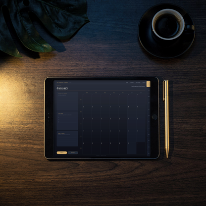 2026 ADHD digital planner open on a tablet on a dark walnut desk at night — the real January monthly page with gold month tabs shown on screen, beside a gold stylus and an espresso cup